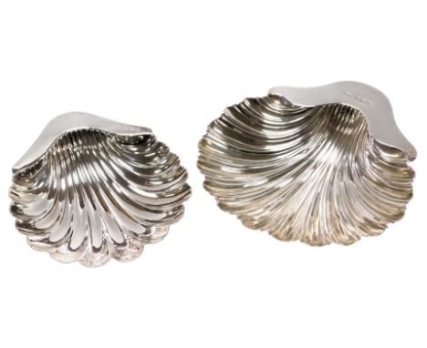 A late Victorian silver butter dish, of scallop shell design, raised on three ball feet, 14cm, Mark Willis, Sheffield 1898, a