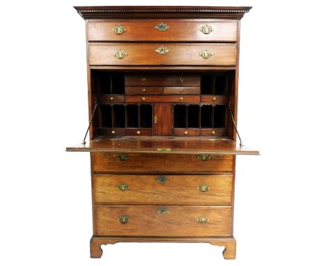 A George III mahogany secretaire chest, the outswept pediment with dentil moulding over two long drawers and a three dummy dr