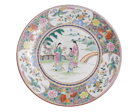 A 20thC Chinese porcelain charger, decorated in coloured enamels, having figures in the central landscape and enclosed by a d