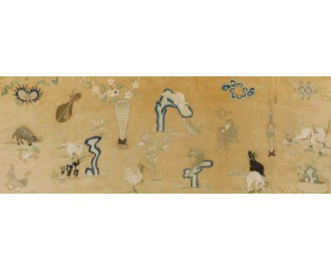 An early 18thC Chinese silk panel, embroidered in colours with animals, flowers, mythical beasts and precious objects, on a b