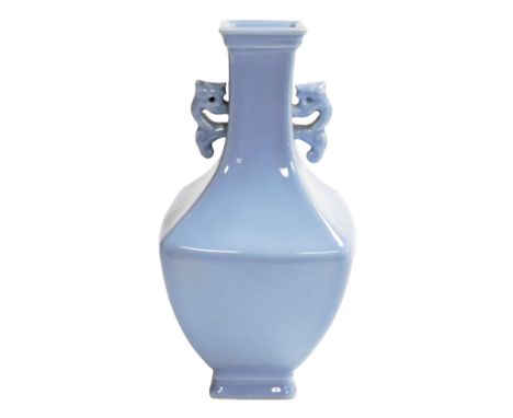 A Chinese porcelain clair de lune bottle vase, of square section with tapering neck and stylized dragon handles. Six characte