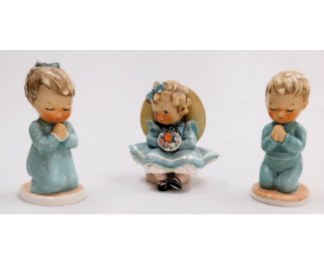 Three Goebel Hummel figures, comprising A Child's Prayer, kneeling boy and girl figure, 13cm high, together with figure of a 