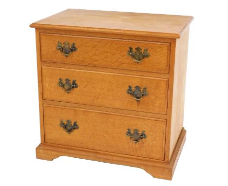 A Georgian style oak chest, by Michael Griffin, with three drawers, raised on bracket feet, 70cm high, 70cm wide, 46cm deep.