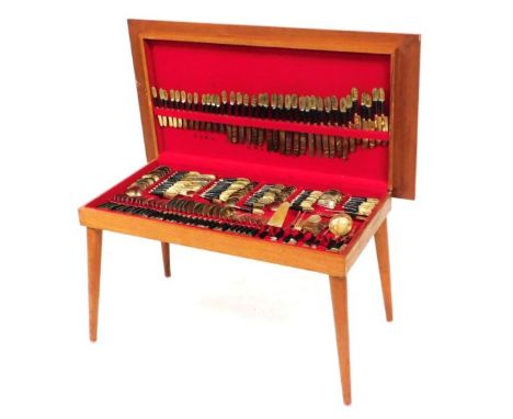 A canteen of Thai bronze wooden handled flatware, twelve place settings, in a fitted cased table, 52cm high, 96.5cm wide, 51c