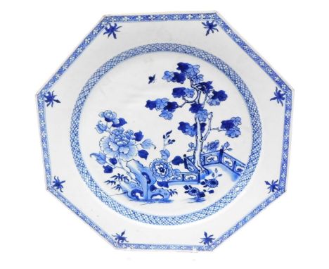 A 18thC Qing dynasty Chinese porcelain octagonal plate, decorated with tree, flowers and fence design, enclosed within diaper