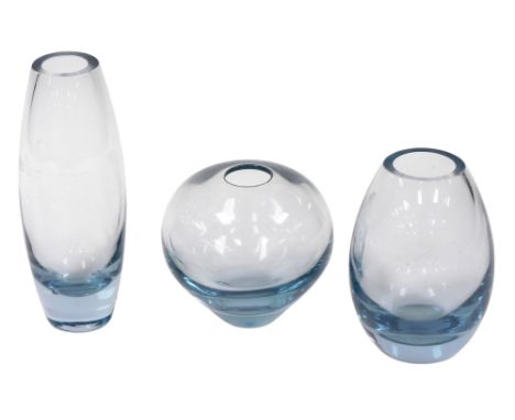 Three Holmegaard blue tinted glass vases, number 5927, 14cm high, 5391, 22cm high, and 15388, 16cm high.