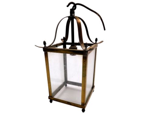 An early 20thC brass framed lantern, with clear glass panels, 37.5cm high.