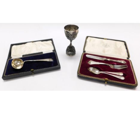 A George V silver baby's spoon, Sheffield 1922, child's fork and knife, Birmingham 1924, two silver coffee spoons, 3.01oz all