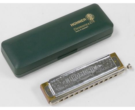 A Hohner Super Chromonica 270 harmonica, in a fitted box.