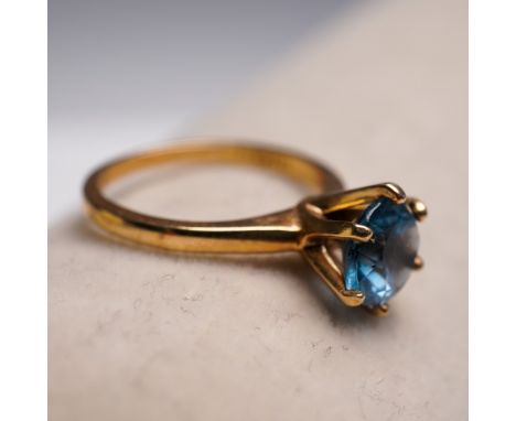 This elegant solitaire ring is crafted in 10K yellow gold and marked SABRINAS 10K inside the band. It features a round facete