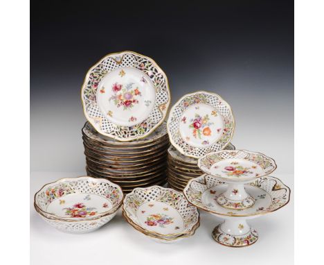 This 34-piece reticulated porcelain dinnerware set by Schumann Arzberg of Bavaria, Germany, showcases the classic Dresdner Fl