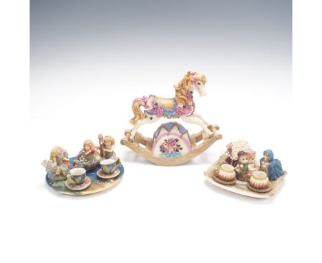 Whimsical 3 piece resin figurine set including a musical rocking horse decorated with pastel florals and gold accents, accomp