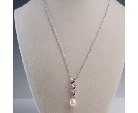 This elegant necklace features a sculptural sterling silver pendant marked VAR CHINA 925, with a polished and matte-finish sp
