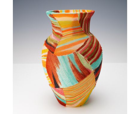 A bold and sculptural Missoni Home patchwork knit vase, standing 10 inches high and exuding the iconic vibrancy of the Italia