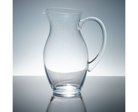 Elegant and timeless, this Christofle clear crystal water pitcher features a gracefully contoured silhouette with a wide bell