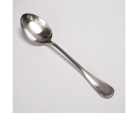 Silver-plated serving spoon by Christofle, crafted in France in the distinguished Malmaison pattern. This large oval spoon sh