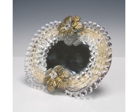 Oval Murano hand-blown glass mirror featuring clear ribbed and beaded glass trim with gold-infused accents and applied floral