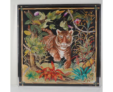Vibrant and iconic, this framed Gucci silk scarf features a fierce jungle tiger prowling through lush foliage in a vivid bota