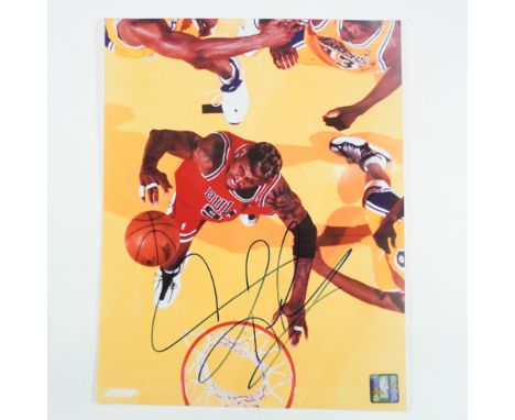 This auction features a signed photograph of Dennis Rodman, the legendary Chicago Bulls power forward, known for his fierce d