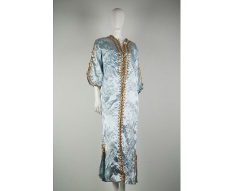 This exquisite vintage Moroccan caftan showcases traditional elegance with a luxurious sky blue satin base intricately adorne
