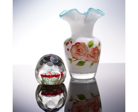 A delightful pairing of art glass featuring a colorful millefiori paperweight and a hand-painted floral vase. The spherical p