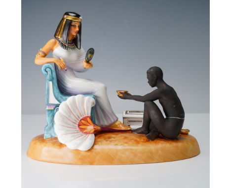 Limited edition finely made grouping of a seated Cleopatra looking in the mirror doing makeup with a black moor by her side. 