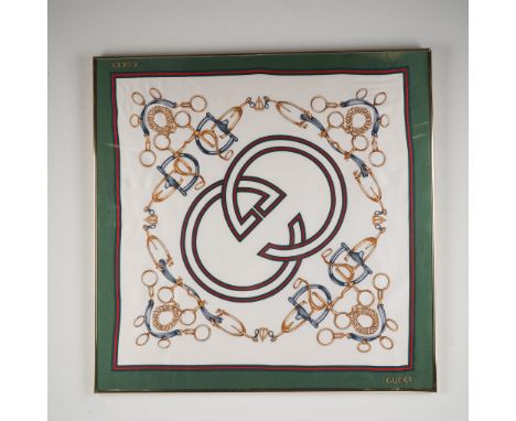 This vintage Gucci silk scarf is presented in a sleek gold-tone frame and features an elegant equestrian motif with gold-tone
