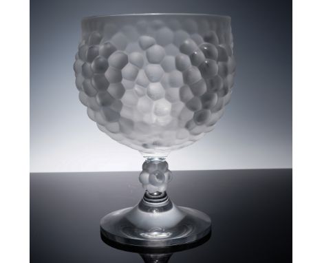 This exquisite bowl from Lalique France features a boldly textured bowl adorned with raised grape clusters, sculpted in frost