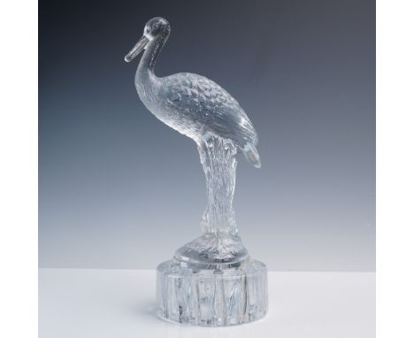 An elegant Cambridge Glass flower frog featuring a sculpted heron perched atop a finely faceted base. Crafted in clear presse