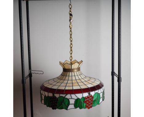 This vibrant stained glass hanging chandelier features a bold grapevine motif, meticulously handcrafted with multicolored gla