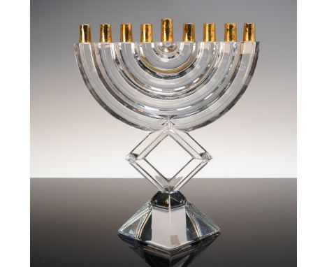 Baccarat crystal menorah featuring a modern arched form with nine polished brass candleholders. The piece is constructed of c