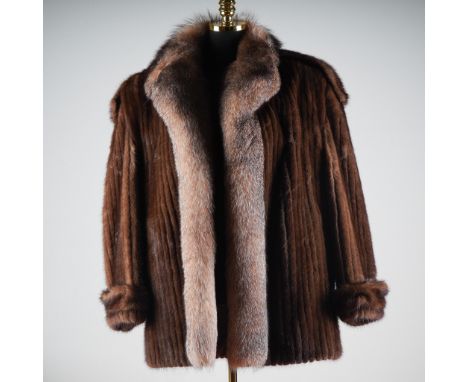 Luxuriously crafted by Alaskan Custom Built Furs in Kansas City, this vintage coat features rich dark brown mink pelts with a
