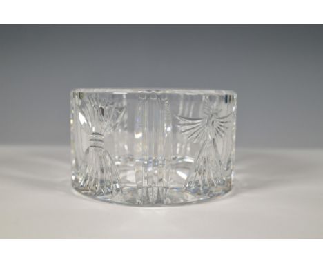 This elegant clear crystal bottle coaster from Waterford's Millennium Collection features intricate cuts representing five to