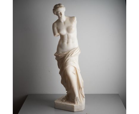 Finely carved from white marble, this elegant sculpture is a neoclassical representation of the Venus of Milo, inspired by th
