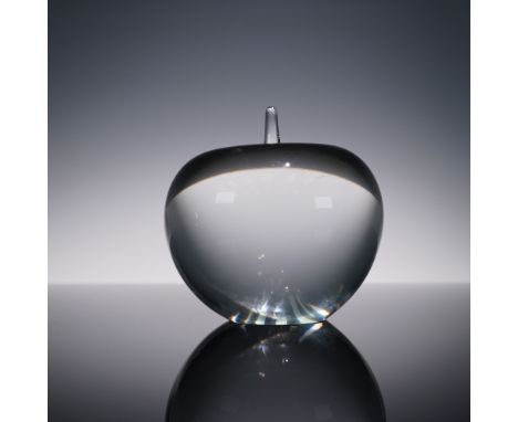 This elegant crystal apple paperweight by Tiffany and Co. features a clear rounded form with a delicately tapered stem, showc