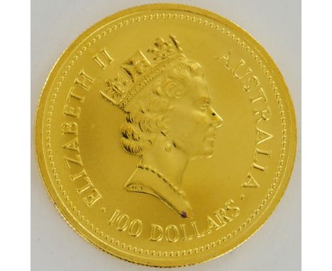 1987 Australian Nugget gold coin containing 1 troy ounce of 99.99% fine gold, encased in a protective slab. The obverse depic