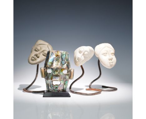 A compelling 4-piece collection of sculptural art, featuring three carved stone heads signed by J.R. LaRate and a striking Me