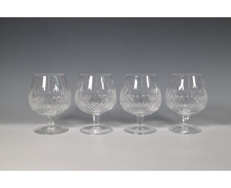 A set of four Waterford crystal brandy glasses in the Colleen pattern, featuring the signature diamond-cut design and rounded