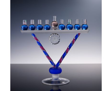 Vibrant Murano glass menorah by Santi, showcasing a bold, modernist V-form with twisted canes of cobalt blue and cranberry re