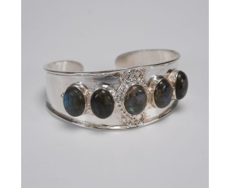 Substantial sterling silver cuff bracelet featuring five bezel-set oval labradorite cabochons. Each stone exhibits hues of bl
