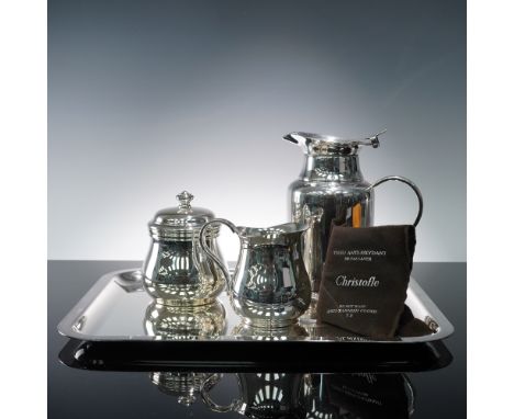 Offered is an elegant Christofle silver plate tea service, comprising three primary serving pieces and a coordinating serving
