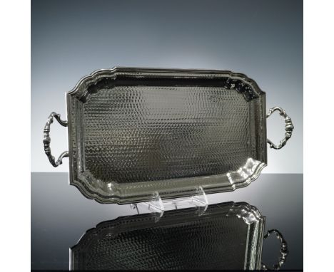 An impressive Italian silverplate serving tray by OLRI, featuring a dazzling hand hammered finish and gracefully scrolled han