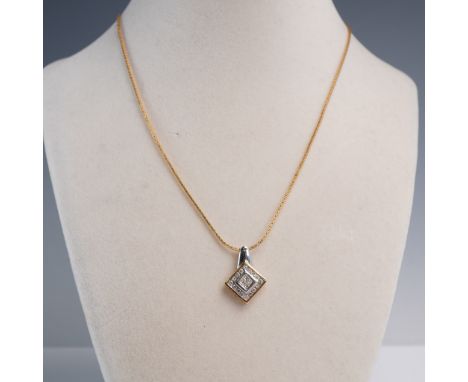 This refined necklace features a square 10K gold pendant set with a cluster of princess-cut diamonds at center, framed by a h