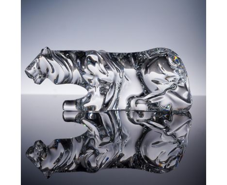 A striking Baccarat crystal tiger figurine, expertly sculpted in clear crystal with a powerful and dynamic crouching pose. Th