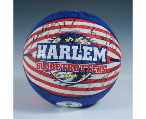 This Baden basketball features the iconic Harlem Globetrotters logo and vibrant red, white, and blue design with star motifs,