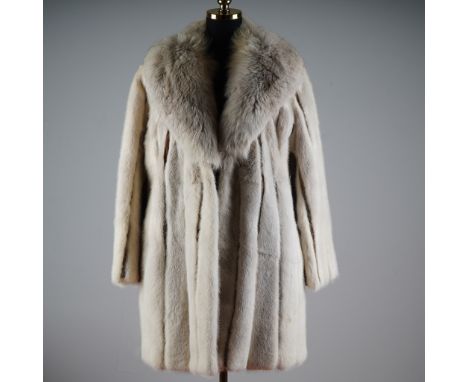 This luxurious vintage silver grey mink fur coat by Kneeter, a Des Moines, Iowa furrier known for refined craftsmanship, exud