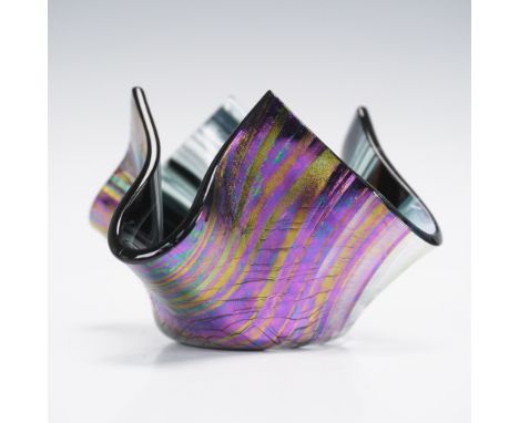 This dazzling handkerchief-style art glass dish captures attention with its fluid form and vibrant iridescent finish. Measuri
