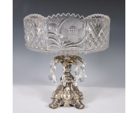 This exquisite crystal glass compote features intricate frosted flower designs and detailed cut patterns along its octagonal 