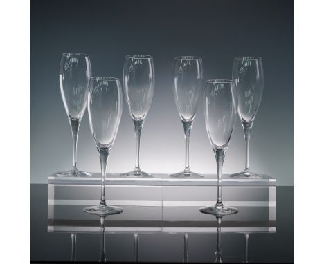 Set of six clear crystal champagne flutes from Christofle in the Albi pattern. Each glass features a classic, unadorned silho