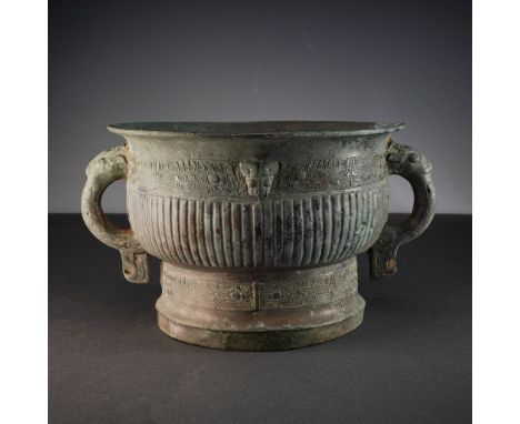 This exceptional ancient Chinese bronze ritual vessel is an excellent piece from the Zhou Dynasty. The vessel is cast with a 